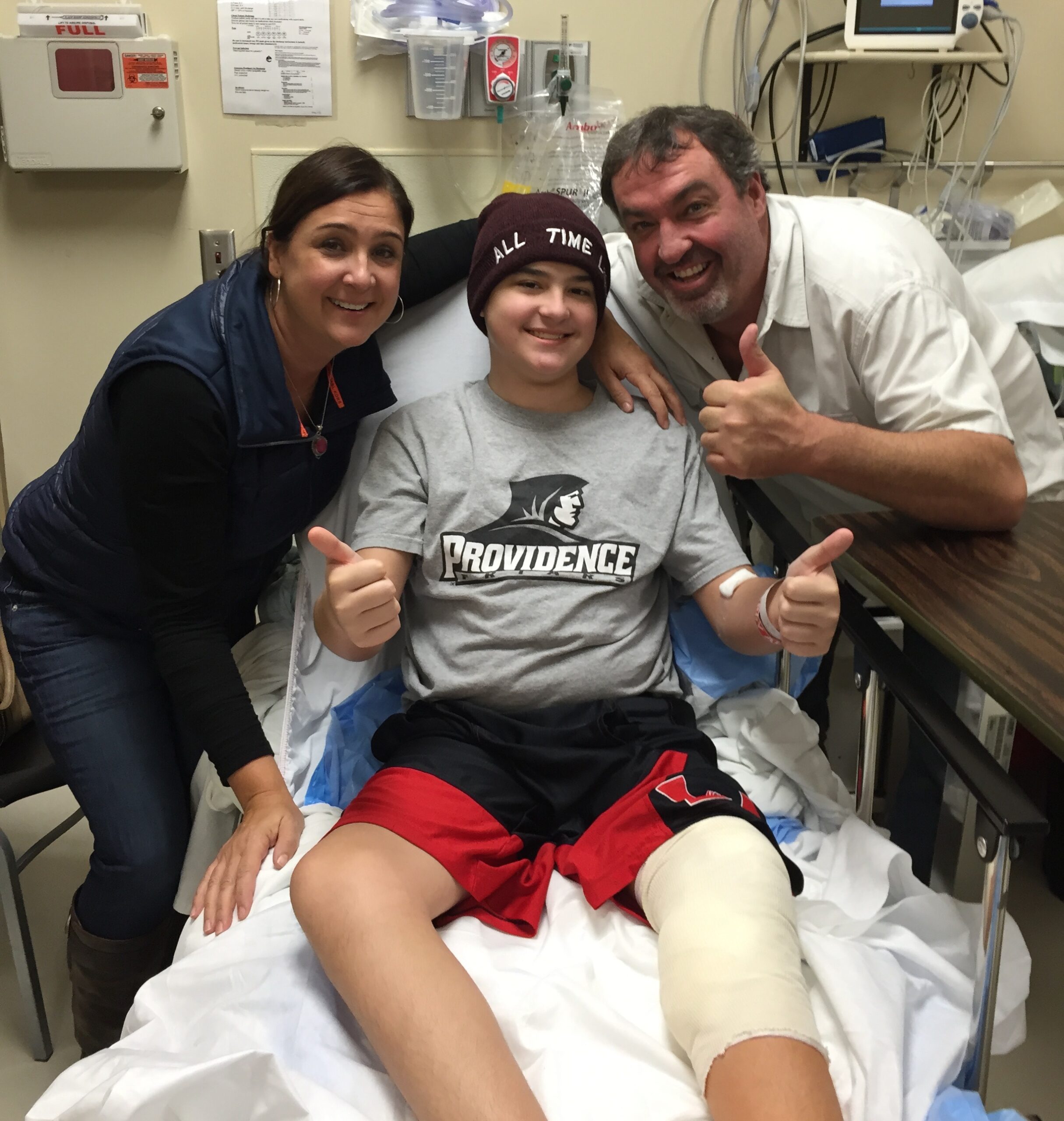 Aidan and his parents in the hospital