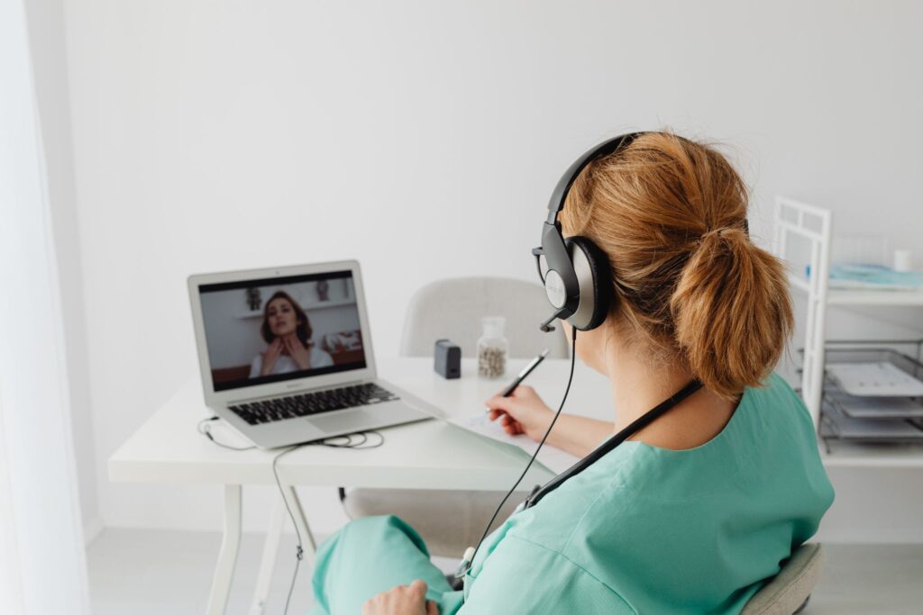 a doctor speaking to a patient remotely