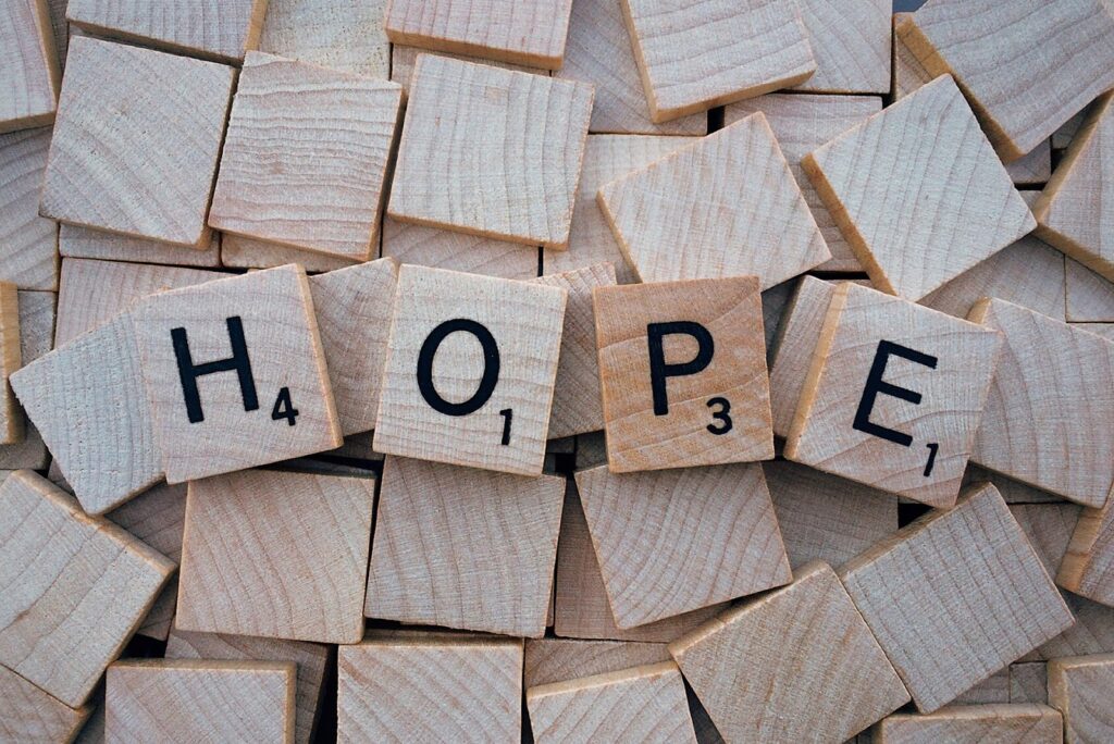 scrabble tiles that spell out "hope"
